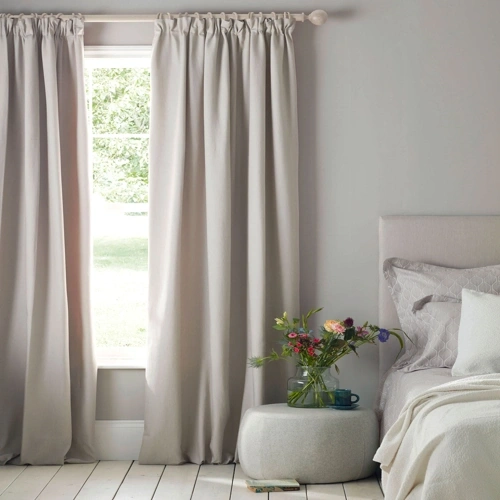 Cotton curtains installed in modern bedroom