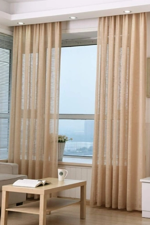 Sheer curtains in Dubai, adding elegance and light to a modern living room.