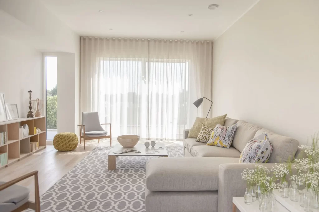 Bright, modern living room with light neutral decor