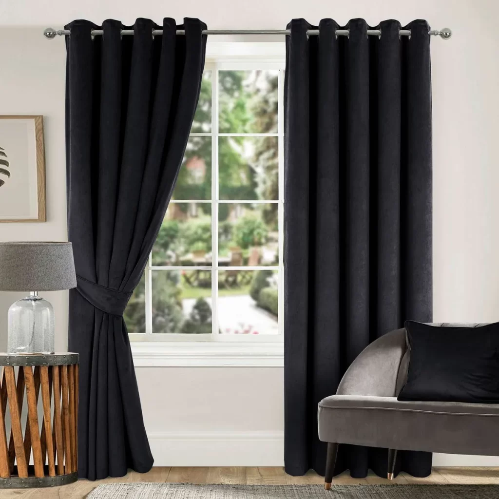 Dark gray or black eyelet curtains framing a window