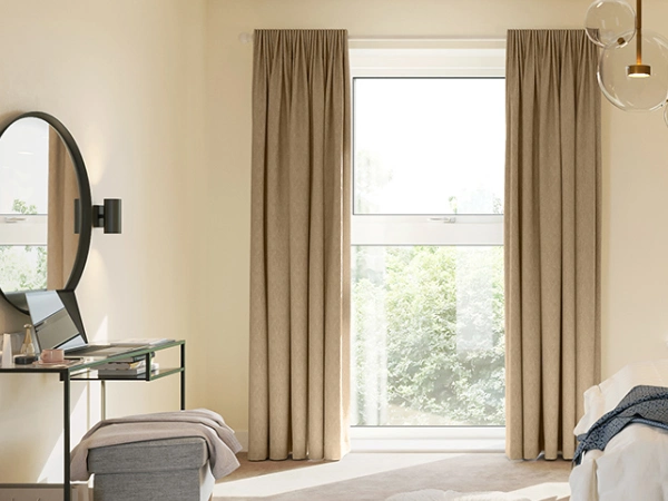 A bright, modern bedroom features a mud-colored Faux Silk Blackout curtains Dubai set, beautifully framing the large window.
