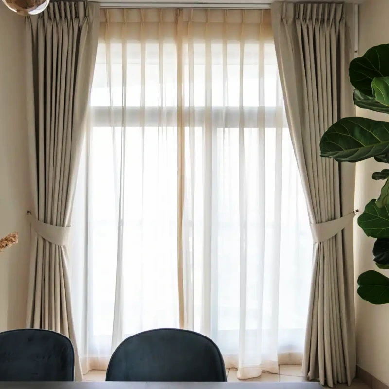 Airy sheer with beige curtains Dubai enhancing cozy living spaces with modern décor trends in Dubai.