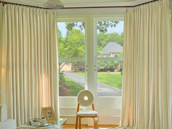 Custom Blackout Thermal Made to measure beige curtains dubai in living room. Guaranteed perfect fit for any large window.