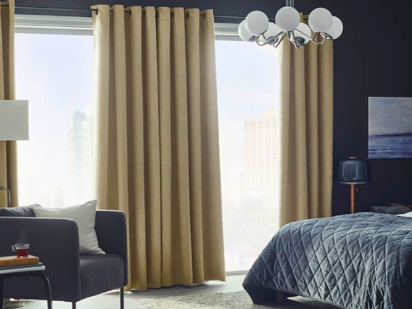 Custom chenille beige curtains Dubai hang on a simple-style rod in a luxury bedroom to enhance the look.