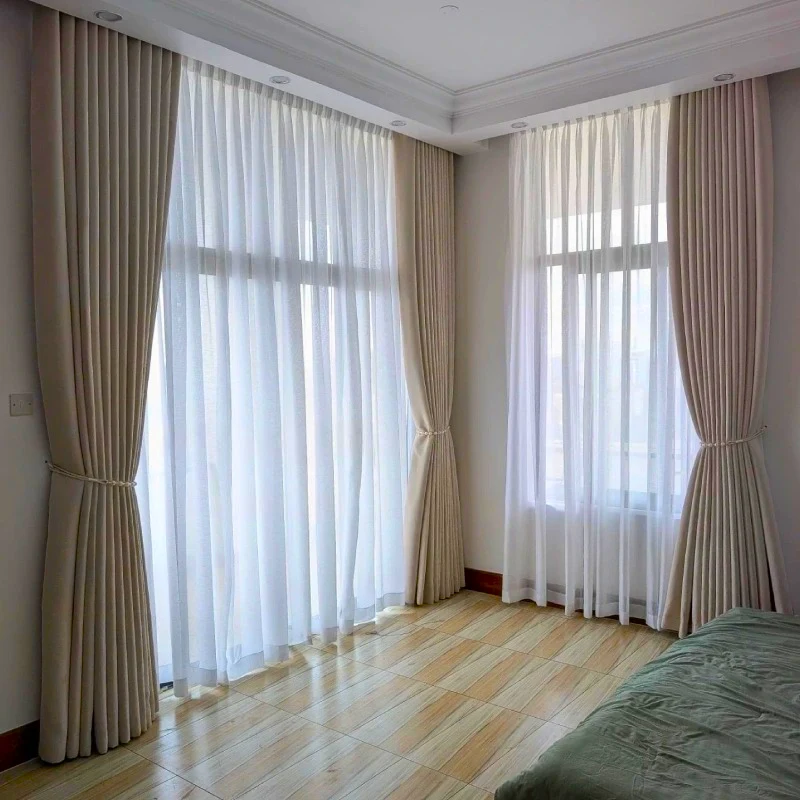 Custom made beige with sheer combination curtains are installed in Dubai Marina Villa.