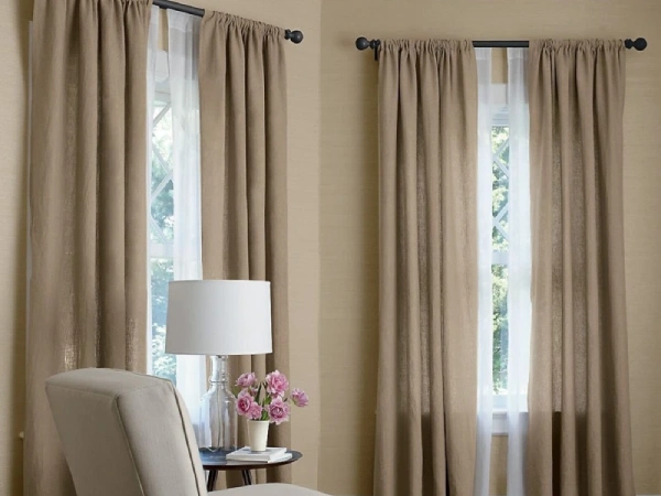 Linen Blackout curtains Dubai Elegant Thermal insulation drapes in a cozy setting.