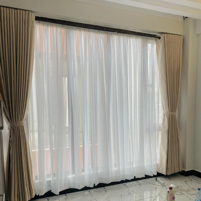 Sheer with beige curtains Dubai adding soft daylight glow, modern window styling and luxury interior vibes in Dubai Apartment.