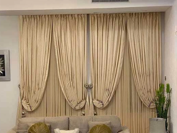 Suede blackout beige curtains Dubai for luxury window styling, soft texture, modern interior look.