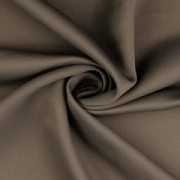 Taupe blackout material, a solid dark neutral fabric ideal for blocking light._