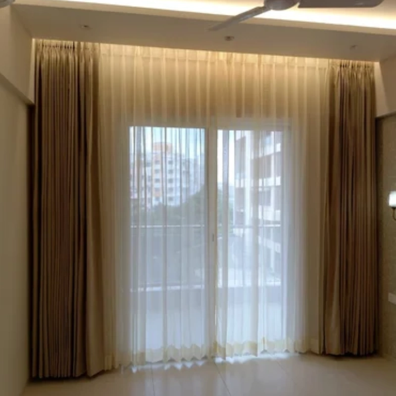 Automatic double track motorized curtains showing the dual rail system and hidden motor unit.
