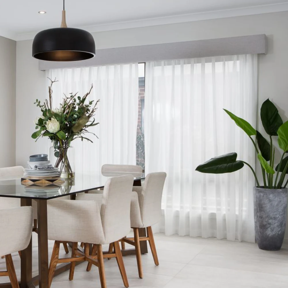Custom-made pelmet sheer curtains adding sophistication to windows.