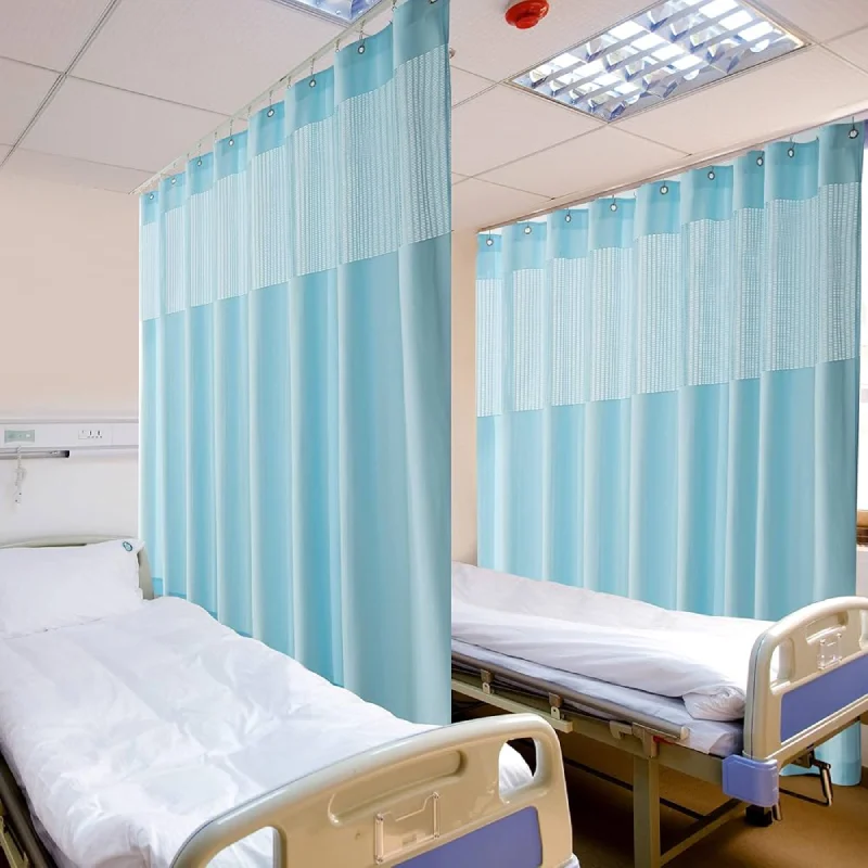 Hospital motorized curtains in a medical ward providing automated privacy between patient beds.