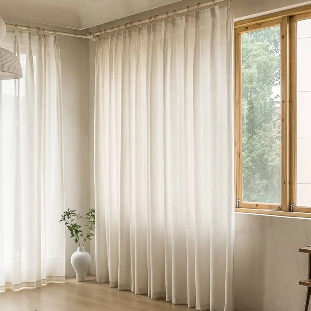 White pencil pleat sheer curtains softly filtering sunlight.