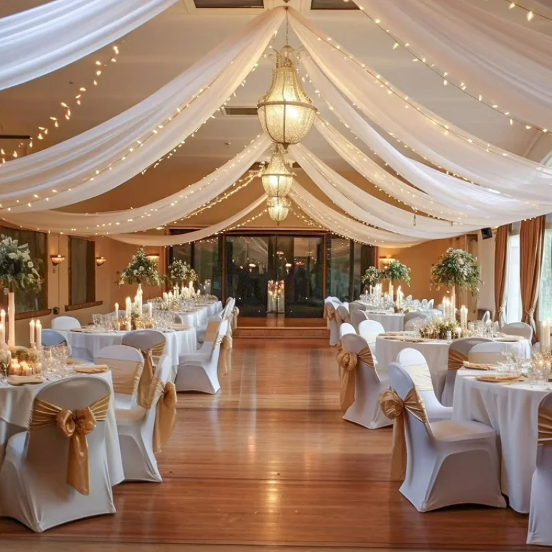 party hall drapes with crisscross white fabric and soft purple ambient uplighting.